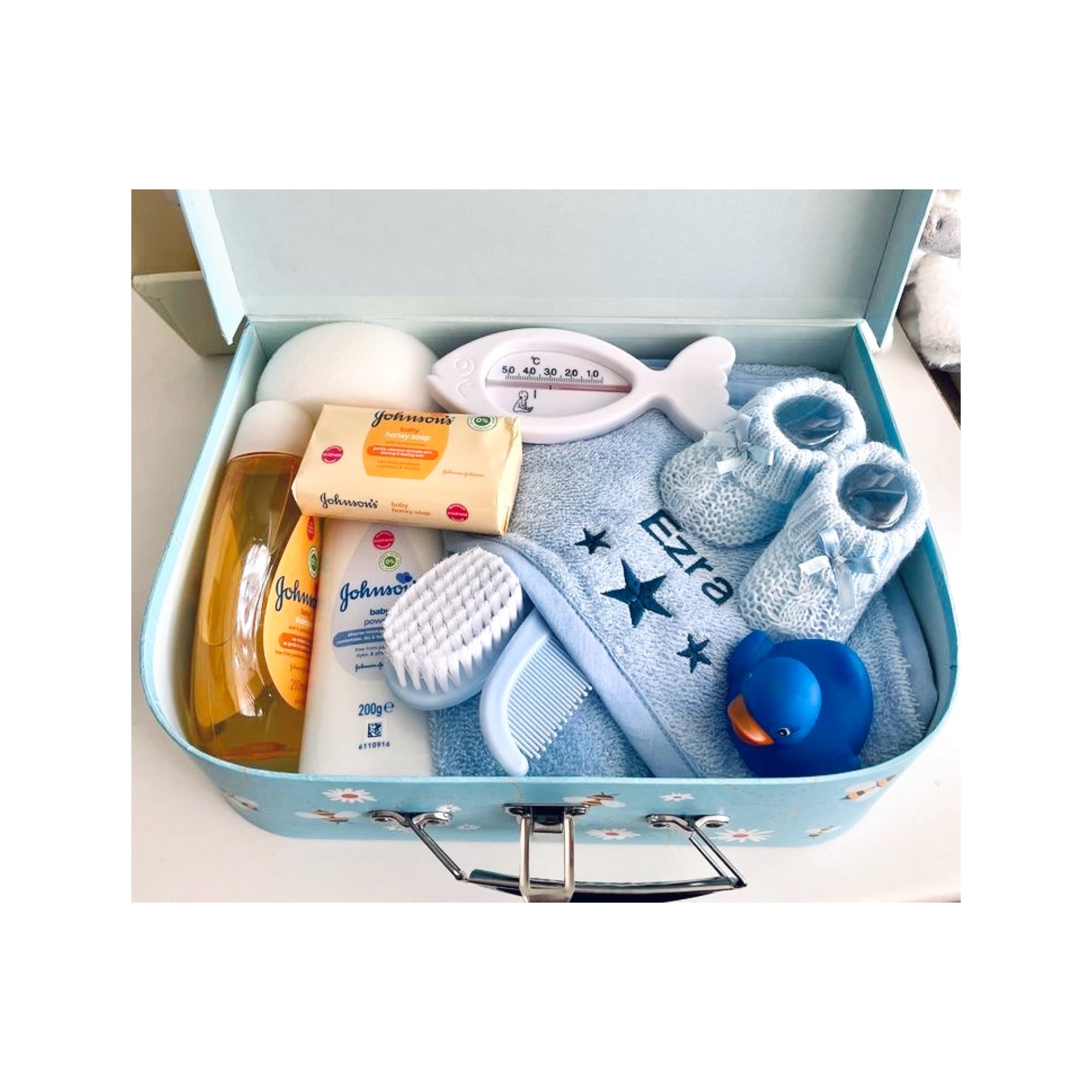 Ultimate baby gift basket filled with newborn essentials including baby bottles, pacifiers, toys, clothes, and skincare items, ideal for baby shower or gender reveal present.