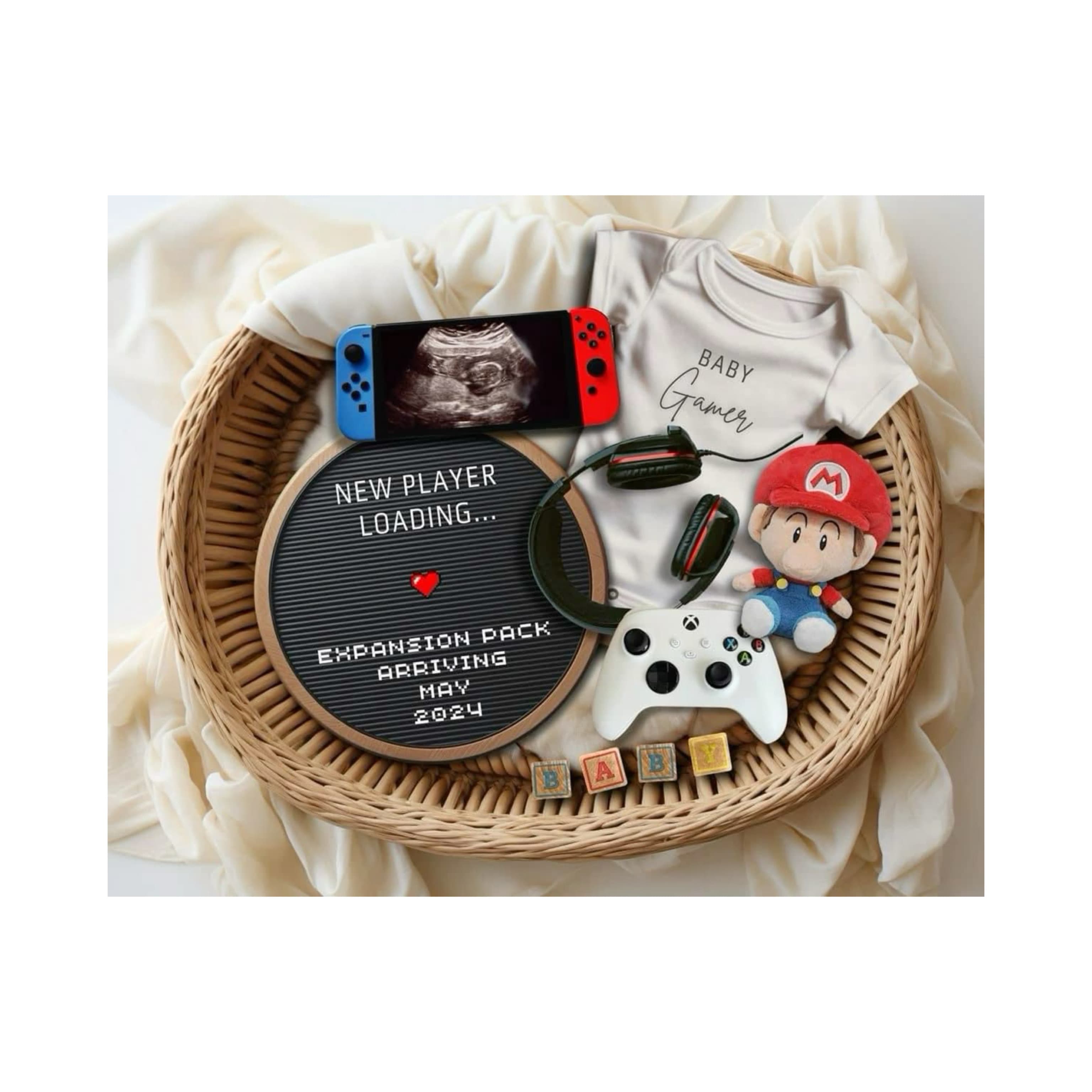 Unique baby gift set basket with newborn essentials, including bodysuit, pacifier clip, soft toy, and creative keepsake plaque, perfect for baby shower or gender reveal present.