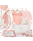 Lightweight floral baby gift set featuring warm-weather clothing and accessories in soft pastel tones