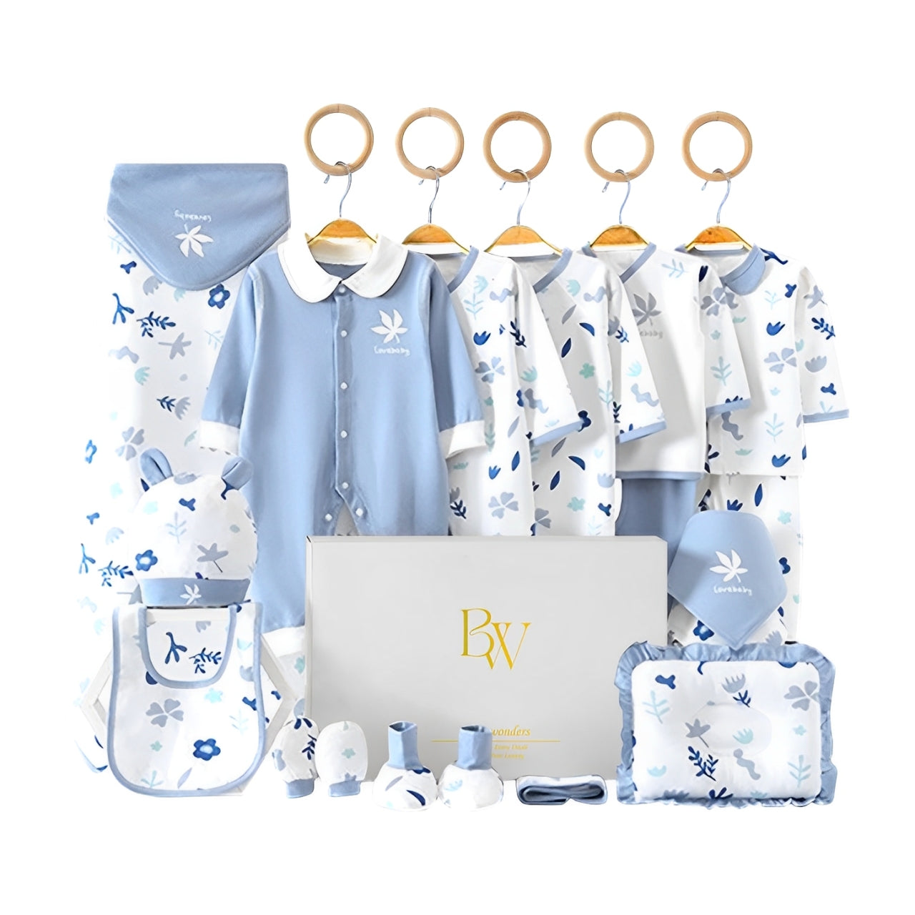 Leaf-themed baby gift set with soft bodysuit, tiny mittens, and neutral-toned socks