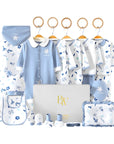 Leaf-themed baby gift set with soft bodysuit, tiny mittens, and neutral-toned socks