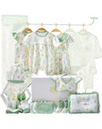 Close-up of glitter-accented baby clothing with summer floral print and matching accessories
