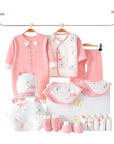 Dolphin-themed baby gift set with bodysuit, wrap, bibs, socks, gloves, pillow, and towel in soft ocean tones