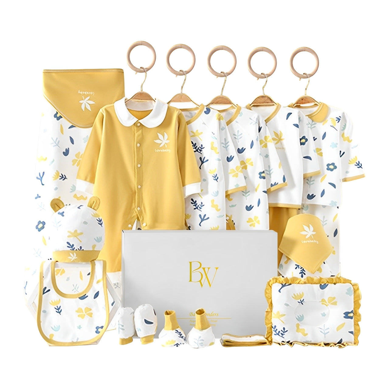 Close-up of leafy newborn bodysuit and accessories in soft organic-style fabric