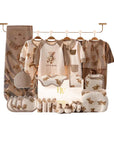 baby gift set with bear clothes, socks, and wrap