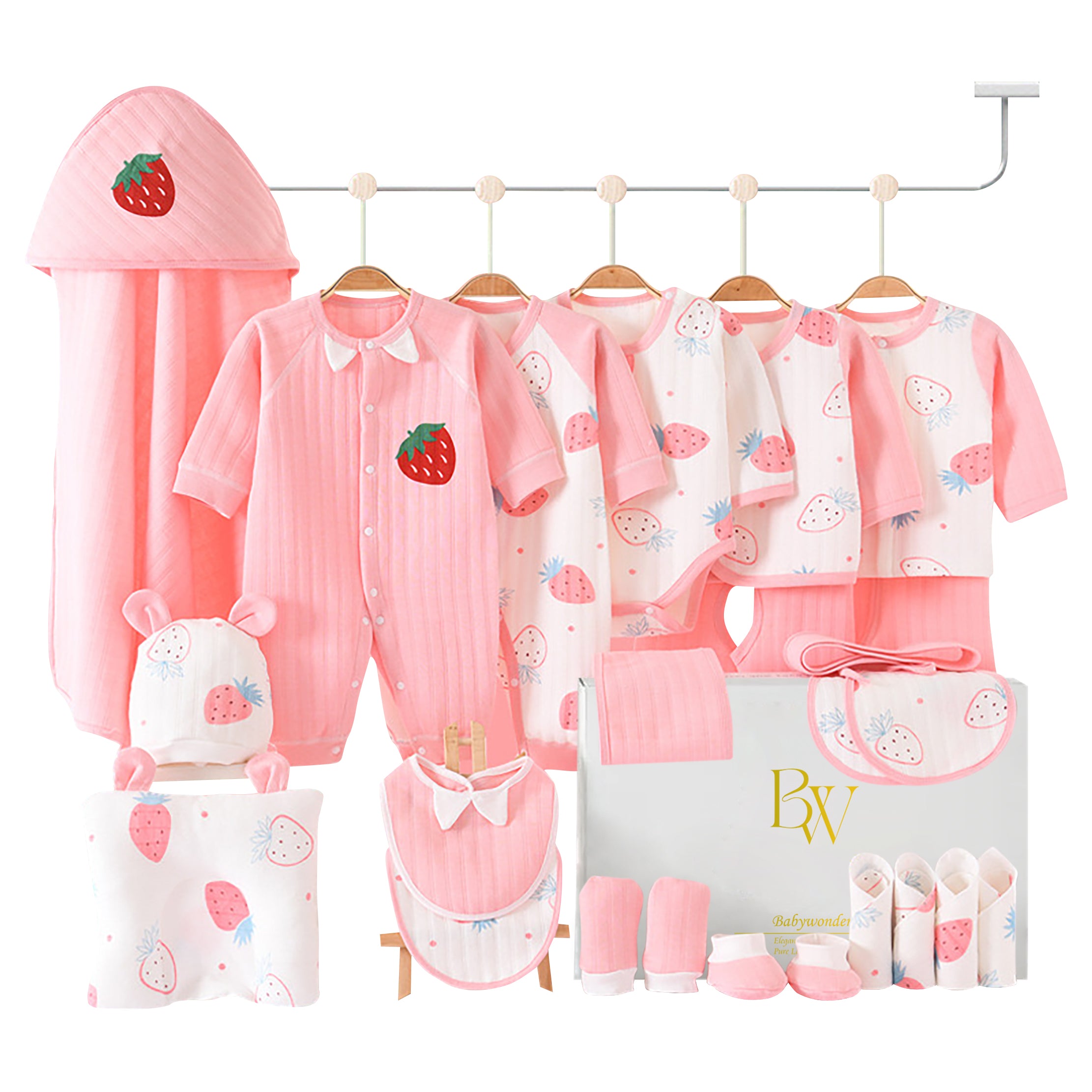 Close-up of soft baby essentials featuring strawberry prints and pink accents, ideal for newborn gifting