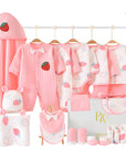 Close-up of soft baby essentials featuring strawberry prints and pink accents, ideal for newborn gifting