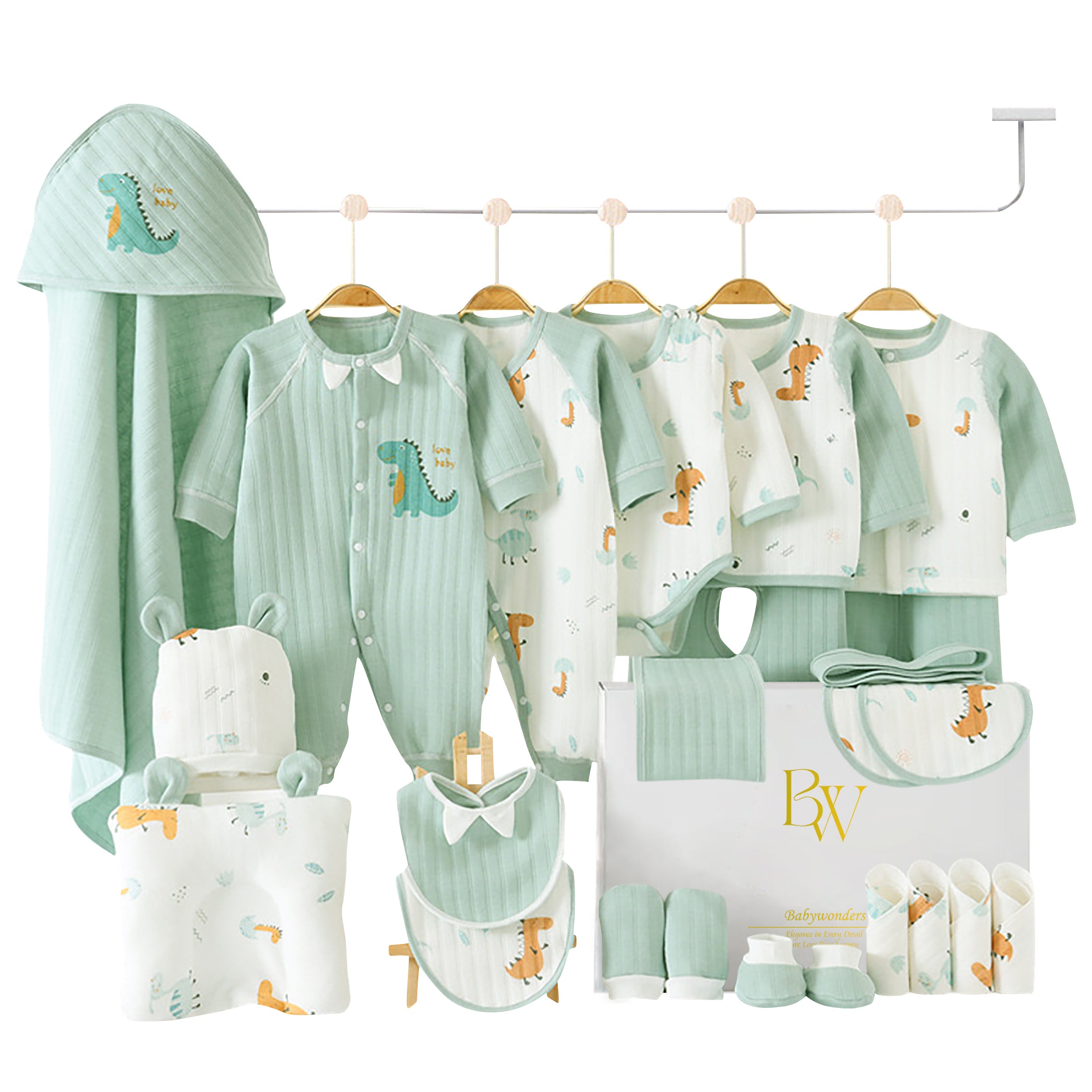 Close-up of green dinosaur print on baby clothing and accessories, perfect for newborn boys or girls
