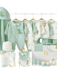 Close-up of green dinosaur print on baby clothing and accessories, perfect for newborn boys or girls