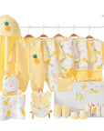 Close-up of newborn essentials with pineapple print and yellow accents, ideal for baby shower gifting