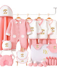 Close-up of tiger-print baby bodysuit and accessories, ideal for newborn gifting