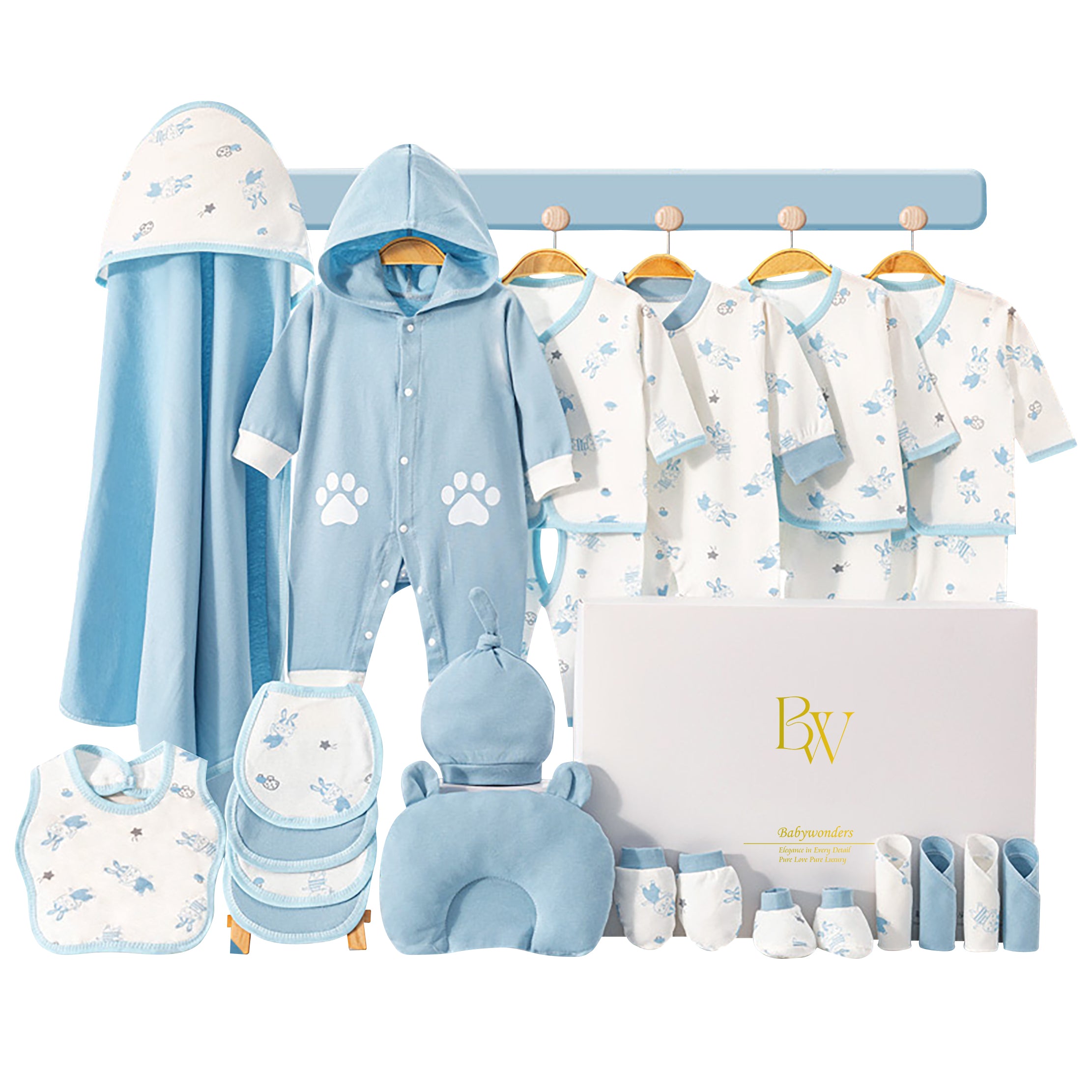 Close-up of newborn clothing featuring playful kitten and paw designs, perfect for gifting
