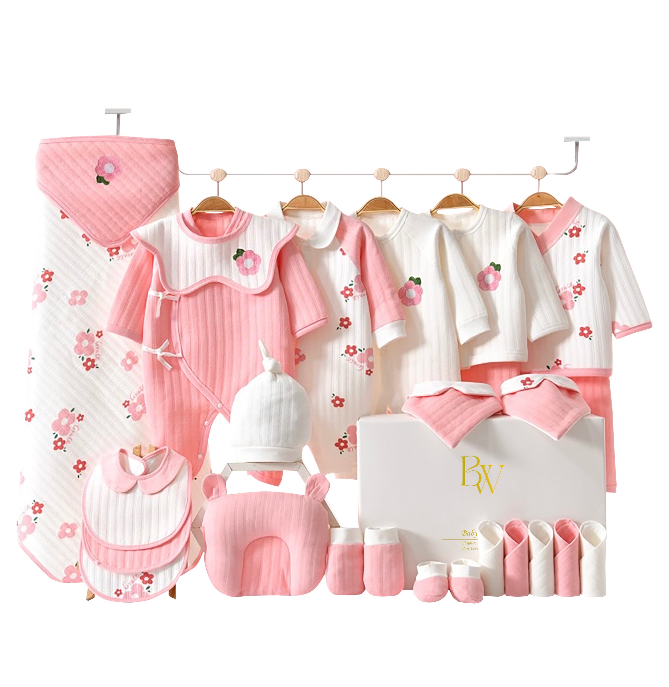 Close-up of soft baby bodysuit with pink sunflower design and matching accessories