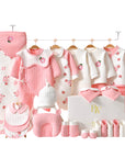 Close-up of soft baby bodysuit with pink sunflower design and matching accessories