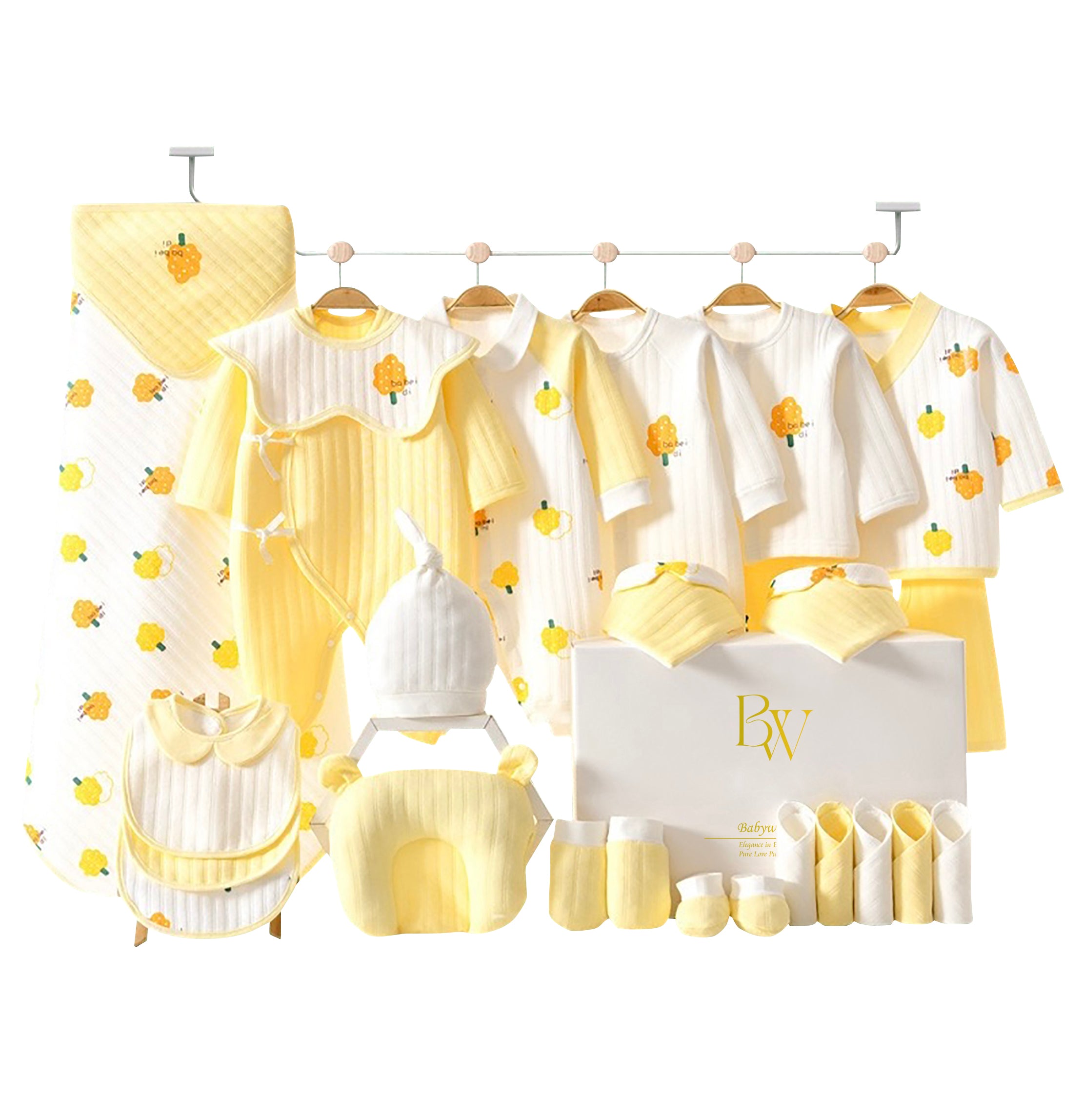 Close-up of yellow tree design on soft baby clothing, perfect for newborn gifting