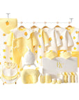 Close-up of yellow tree design on soft baby clothing, perfect for newborn gifting