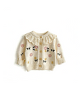 Baby floral knit cardigan front view in apricot with embroidered flowers and ruffle collar