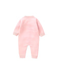 Back view of pink knitted baby romper with long sleeves
