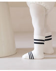 Toddler wearing navy bear socks – unisex soft cotton baby socks from BabyWonders UK