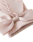 Close-up of pink grosgrain bow on baby lace knee-high socks, soft and stretchy cuff