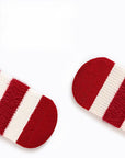 Close-up of soft red knit baby socks showing warm texture and high-quality fabric for newborns.