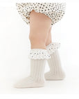 Baby wearing polka dot ruffle socks – adorable soft cotton mid-calf baby socks