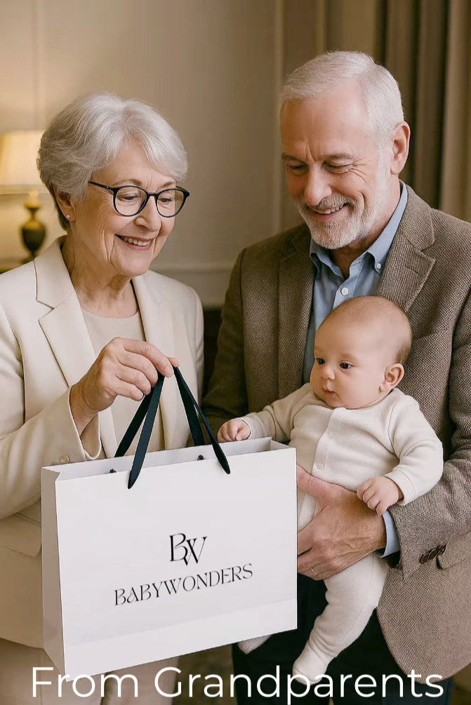 Grandparents gifting a Babywonders baby gift set to their newborn grandchild