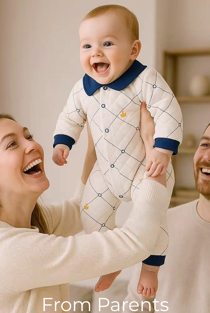 Happy parents lifting their baby dressed in Babywonders outfit