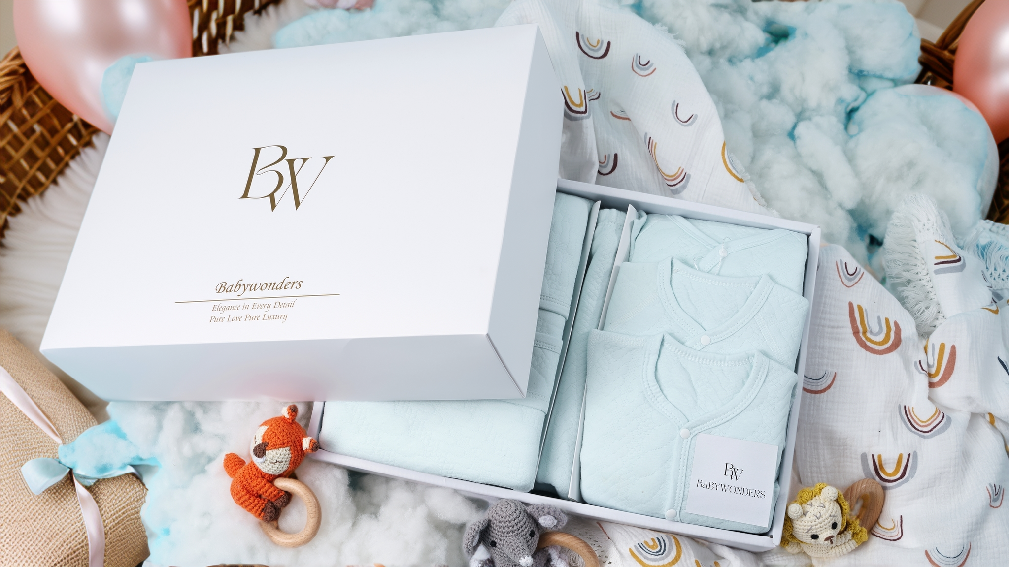 Babywonders UK full gift set collection display – showing curated baby boxes with bodysuits, swaddles, bonnets and soft essentials for newborns