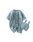 Blue-green knitted baby romper with ruffle front and bunny-ear hat, soft and cozy outfit for newborns and infants.