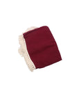 Burgundy cotton baby blanket with tassel trim, soft breathable newborn blanket for nursery, cot and stroller use.