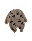Front view of baby knit cherry romper with button closure and soft cotton fabric.
