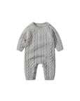 Baby cable knit romper front view with classic knit texture and long sleeves