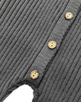 Detailed view of front button design on charcoal ribbed baby romper, soft knit cotton