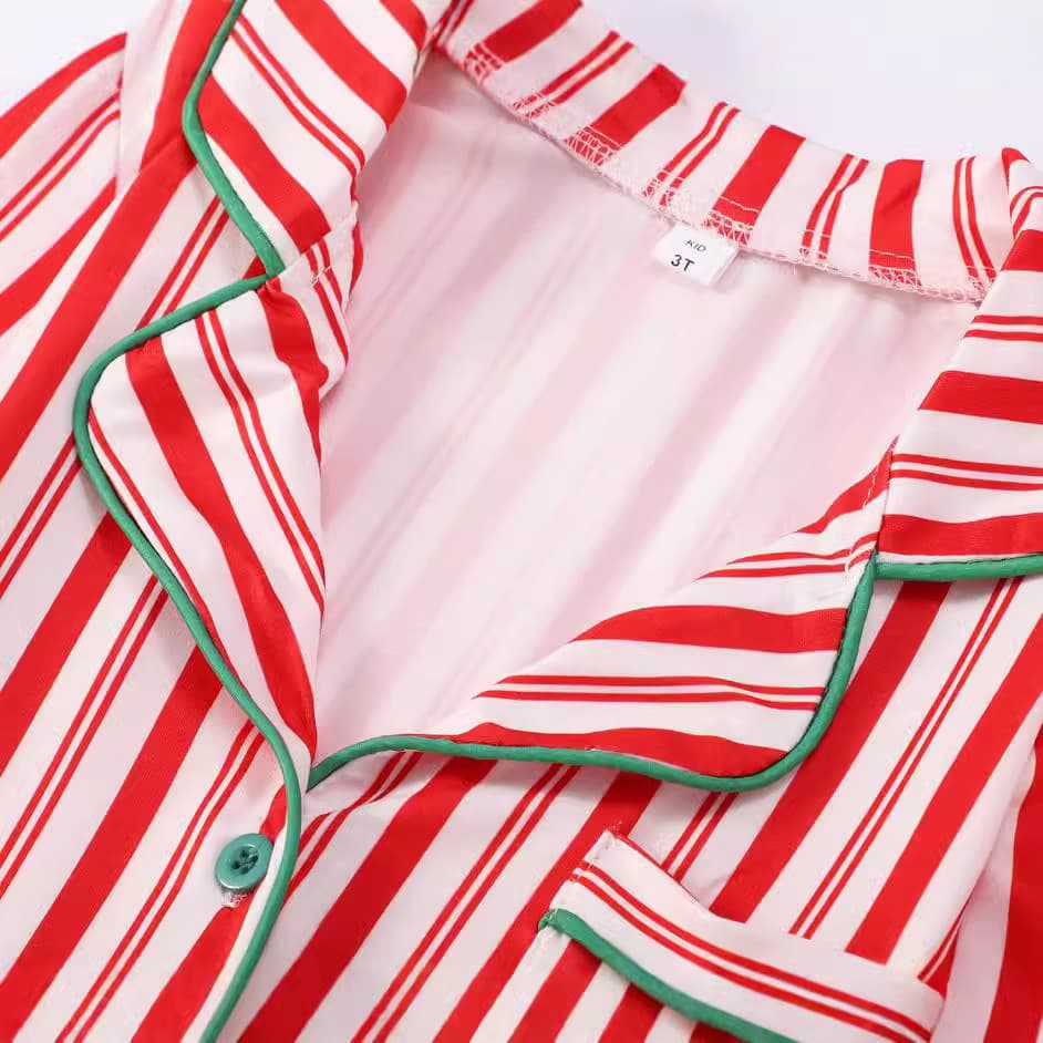 Red and white striped Christmas pajama top with green trim and buttons