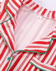 Red and white striped Christmas pajama top with green trim and buttons
