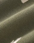 Close-up of soft cotton knitted fabric in army green baby romper showing breathable and thick texture.