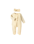 Cream-colored baby romper with ruffle front and matching headband, gentle cotton fabric