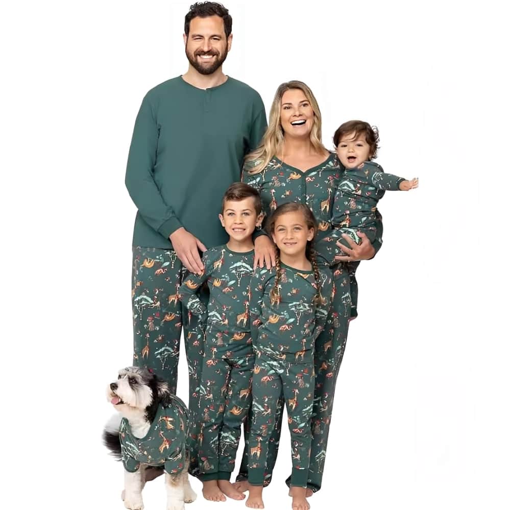 Parents and children in matching green animal print Christmas pajamas for family photos