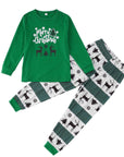 Kids matching Christmas pajamas in green with reindeer and holiday tree design