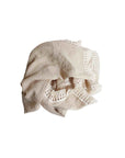 Grey cotton baby blanket with tassel edges, soft breathable newborn blanket for nursery, cot and stroller use.