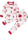 Kids matching Christmas pajamas with festive Santa Claus and reindeer design.