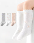 Knit bow knee-high baby socks set in white, grey, and pink – cotton lace-trim design from BabyWonders UK