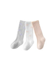 Folded cotton knit baby socks in neutral tones – soft and elegant design