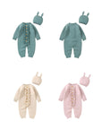 Three-color set of knitted baby rompers with matching hats in blue-green, light pink, and light apricot — soft cotton blend baby wear.
