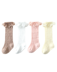 Lace knit baby socks collection in four colors – pink, white, cream, and brown. Soft cotton ruffle socks for girls.