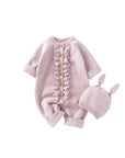 Light pink knitted baby romper with ruffle design and bunny-ear hat, cute and comfortable infant jumpsuit.