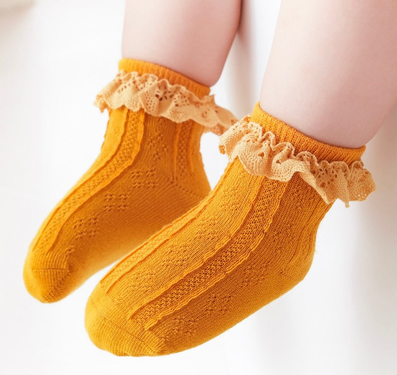 Mustard yellow lace frill baby socks, warm cotton knit with cute scalloped lace cuff.