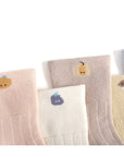 Set of socks with small animal illustrations on a white background