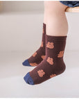 Baby wearing brown bear patterned cotton baby socks – soft cotton comfort